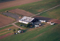 The hangar with (from left to right) the K8 glider, the tow plane Piper Super Cub D-EKOL, the Robin DR.400/180R and the Piper Archer D-ELIN in late summer of 1994.